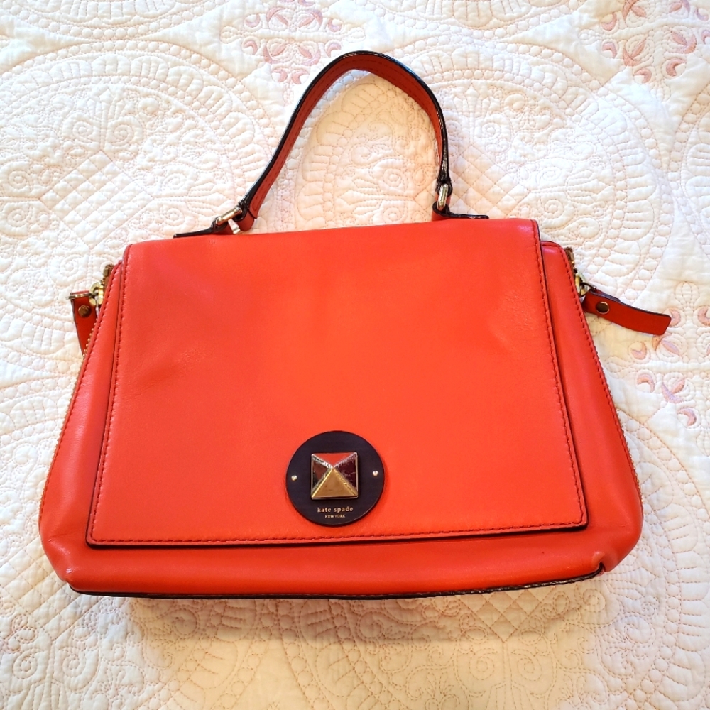 Kate Spade orange leather purse.  12" x 9" Two side zippers three inside pockets